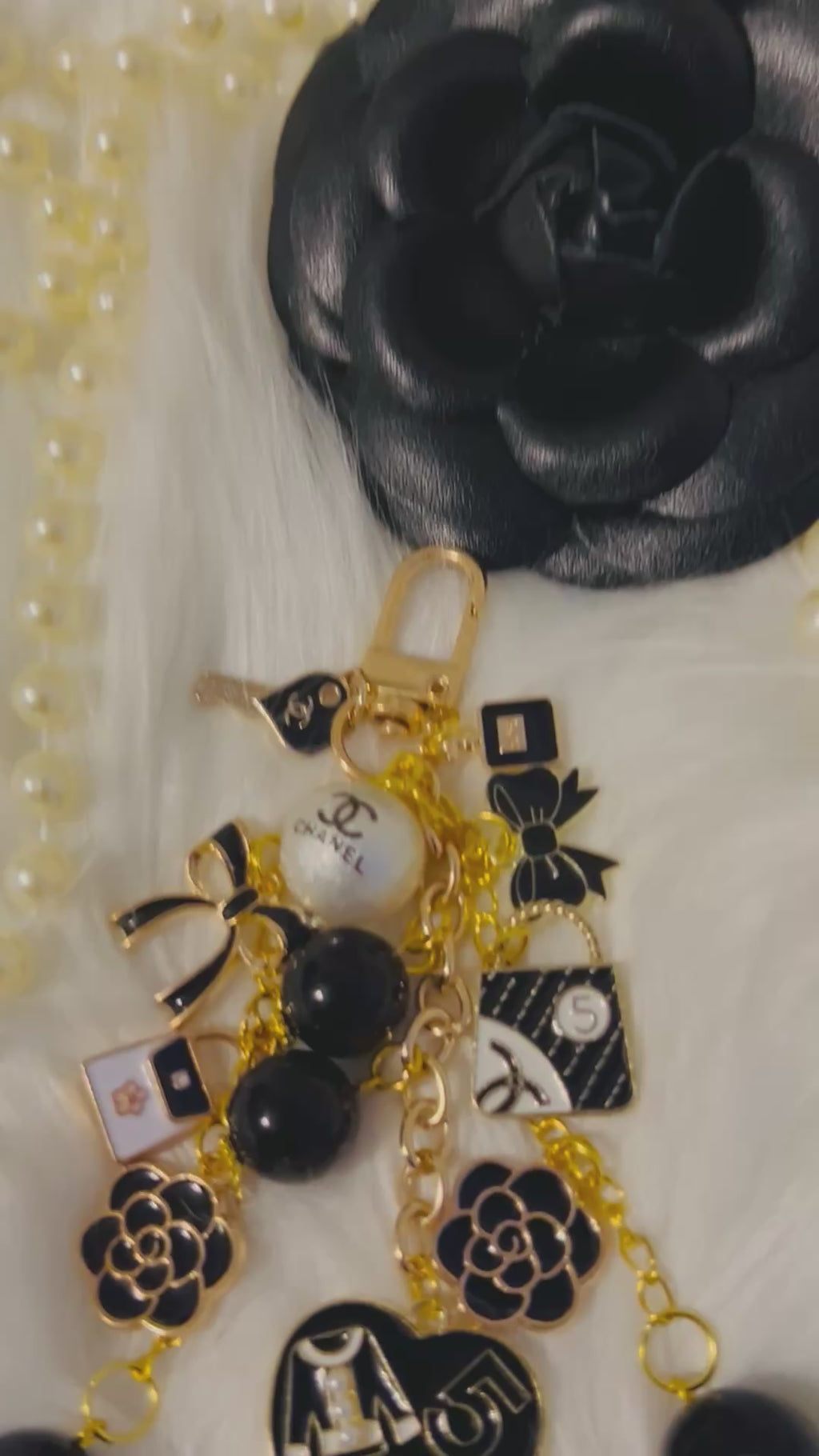 Chanel inspired black pearl bag charm-gold multi-charm with no 5 heart, camellia, bow-styled on classic flap