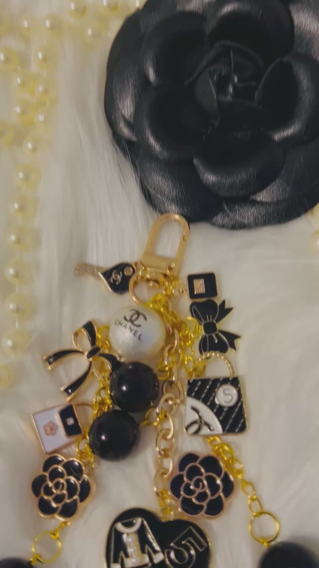 Chanel inspired black pearl bag charm-gold multi-charm with no 5 heart, camellia, bow-styled on classic flap